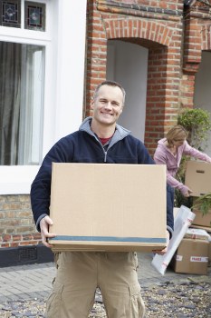 Moving boxes and packing materials prepared for a home move in Catford