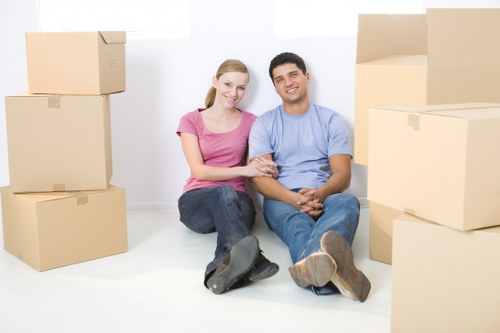 Reliable removal services in Catford loading items into a moving van