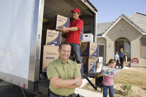 Removalists carefully moving large furniture during a Catford relocation