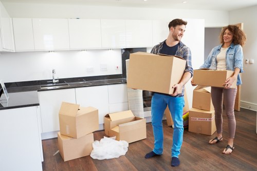 Unloading boxes into a new flat during a Catford relocation