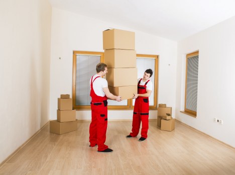 A professional removals crew handling belongings carefully