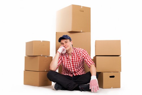 Business relocation team handling computers and desks during an office move in Catford